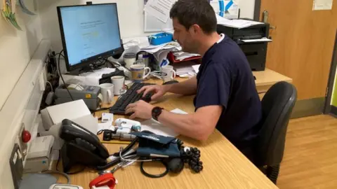 BBC Dr Paul Evans in his surgery