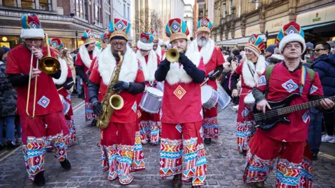Mark Waugh men in music band wearing colourful outifits