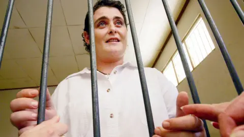 AFP Renae Lawrence in a jail cell in 2005 speaking with a relative