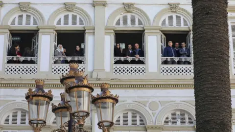 AFP People looking out of windows in Algiers, Algeria - Wednesday 6 December 2017