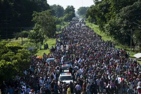 Encarni Pindado More than 7,000 people have joined the caravan which has so far walked from San Pedro Sula in Honduras to Huixtla in Mexico