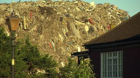 Rubbish mound behind property