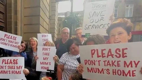 Gemma Dillon/BBC Protestors outside the Town Hall, Huddersfield