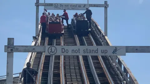 PA Media People trapped on Blackpool Pleasure Beach's Grand National