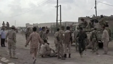 AFP Screengrab taken from video showing Yemeni soldiers after a drone exploded above al-Anad military base in Lahj, Yemen (10 January 2019)