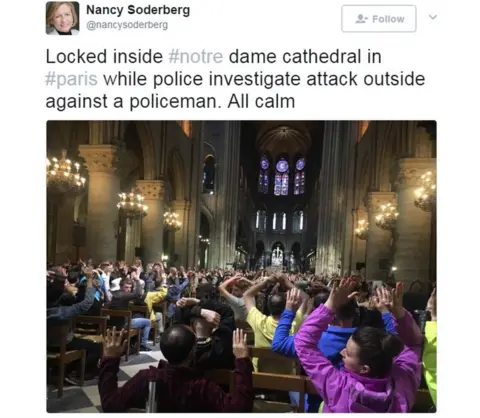 Twitter - @nancysoderberg Locked inside #notre dame cathedral in #paris while police investigate attack outside against a policeman. All calm