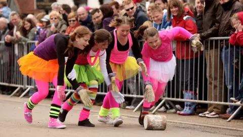 Getty Images Girls rolling cheese in Stilton