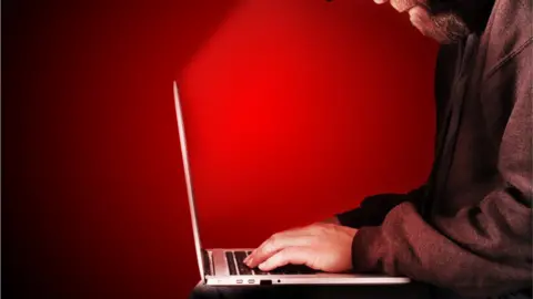 Getty Images Man on computer