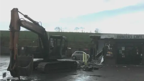 BBC Digger outside filling station