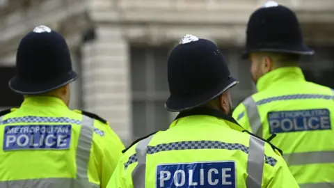 EPA-EFE/REX/Shutterstock Metropolitan police officers