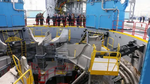 Reuters The delegations examine a rocket launchpad