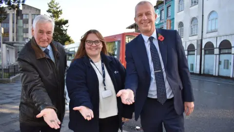 North East Lincolnshire Council Councillor Stewart Swinburn, Lani Lamming, from Equans, and Dave Skepper, from Stagecoach