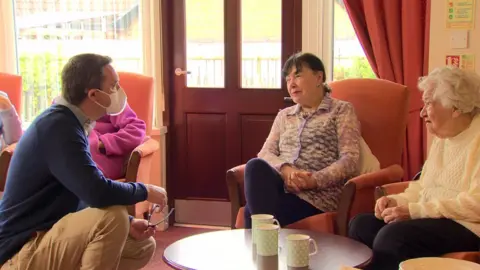 BBC Older people in Montgomery Manor speaking to a support worker
