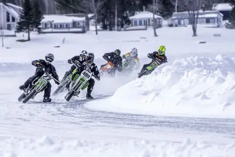 Greg McDougall Motorbike racing on snow