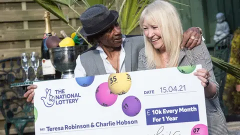 National Lottery/PA Wire Teresa Robinson and Charlie Hobson