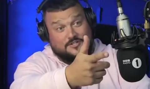 Charlie sloth pointing at Logan Paul