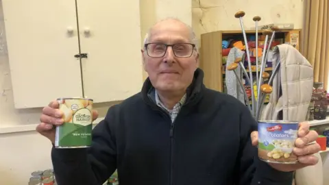 John Devine/BBC Food bank volunteer Mr Richard Housell, 80.