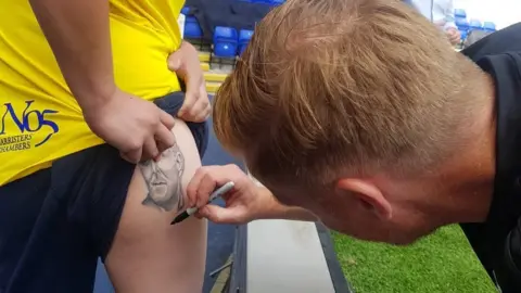 @BCFC Mr Monk signing the tattoo