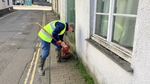 Volunteer Jim Foster on Poundwell Street, Modbury, Ivybridge, Devon