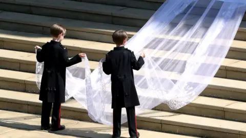 Reuters Pageboys John and Brian Mulroney lift train of Meghan Markle's dress