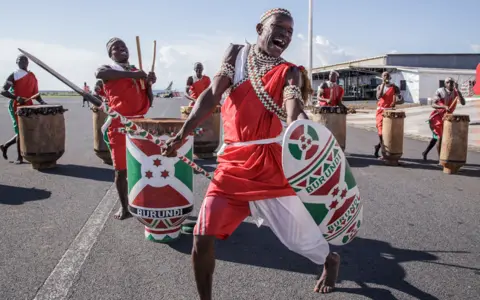 Tchandrou Nitanga/AFP Burundian drummers performing at the airport in Bujumbura, Burundi - Friday 5 May 2023
