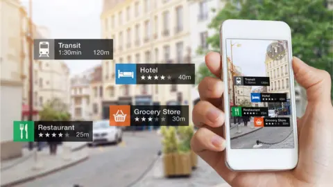 Getty Images Graphic showing smartphone showing retail outlets in high street