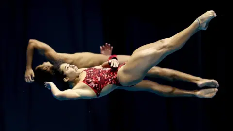 Kiyoshi Ota/EPA-EFE/REX/Shutterstock Two synchronised divers on 23 July 2023