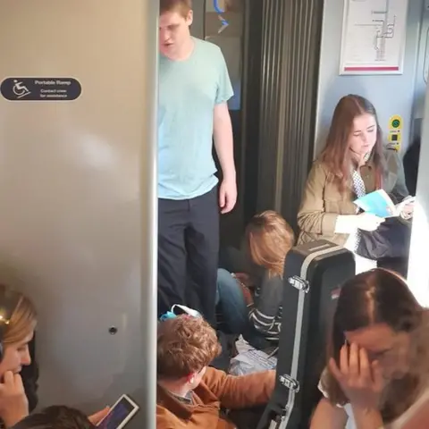 Andrew Coutts Overcrowded train