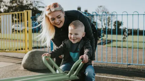 Woman with young boy at park