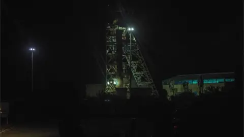 AFP/getty Photograph taken in the dark shows the mineshaft of the mine where men are trapped