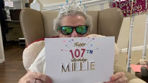 John Fairhall/BBC Millie Hopkins and her 107th birthday cards