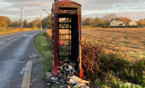 Luke Deal/BBC A burnt out phone box