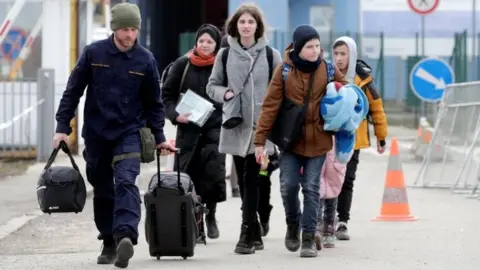 Reuters People fleeing the Russian invasion of Ukraine, arrive in Vysne Nemecke, Slovakia