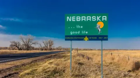 Universal Images Group via Getty Images Welcome to the State of Nebraska - Road sign