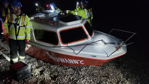 Beer Coastguard Rescue team The boat on shore