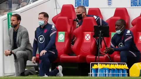 Getty Images Gareth Southgate takes the knee