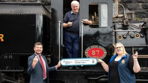 National Lottery Volunteers and staff on a locomotive