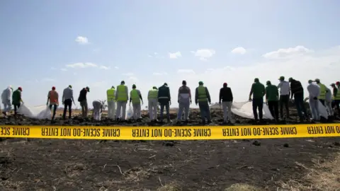 Getty Images Investigators at the Ethiopian Airlines crash site