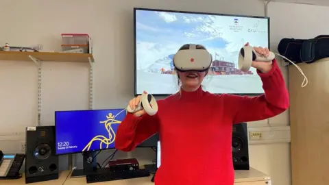 Natalie Malcolm/BBC Person using VR headset