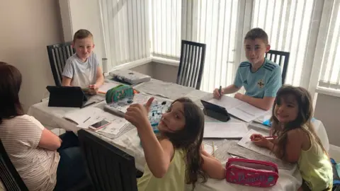 BBC The Lawson family sitting down for some home learning