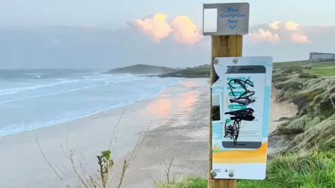 Vandalised sign at Fistral beach in Newquay