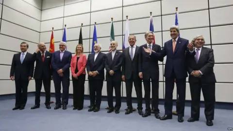 AFP (From L to R) Chinese Foreign Minister Wang Yi, French Foreign Minister Laurent Fabius, German Foreign Minister Frank-Walter Steinmeier, European Union High Representative for Foreign Affairs and Security Policy Federica Mogherini, Iranian Foreign Minister Mohammad Javad Zarif, Head of the Iranian Atomic Energy Organization Ali Akbar Salehi, Russian Foreign Minister Sergei Lavrov, British Foreign Secretary Philip Hammond, US Secretary of State John Kerry and US Secretary of Energy Ernest Moniz pose for a group picture at the United Nations building in Vienna, Austria (14 July 2015)