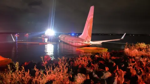 US Navy via Reuters A Boeing 737 aircraft sitting on the water