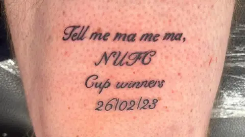 Kris Cook A tattoo on his leg saying 'Tell me ma, me ma, NUFC Cup winners 26/02/23'