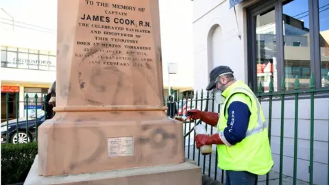 Reuters Protesters scrawled graffiti on a statue of Capt Cook in Sydney