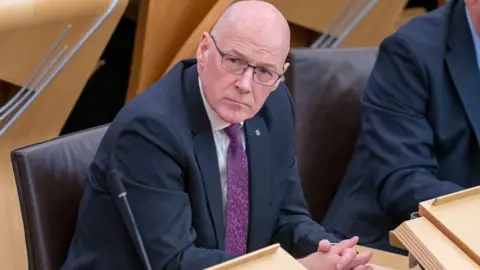 PA Media John Swinney