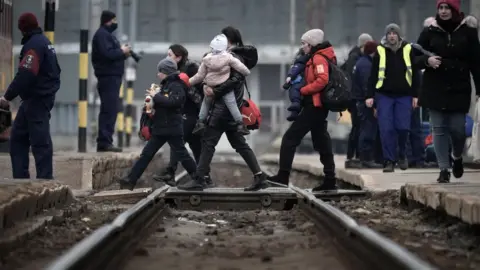 Getty Images Refugees fleeing Ukraine arrive at Zahony train station in Hungary