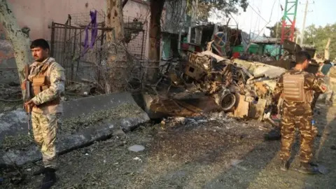 EPA Afghan soldiers patrol outside a prison during an ongoing raid in Jalalabad. Photo: 3 August 2020