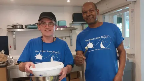 Stuart Low Trust Staff cooking in kitchen