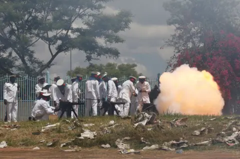 Reuters Kenyan military fire a cannon salute in Nairobi, 28 November